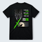 WOFF black 100% cotton unisex crew neck t-shirt with a graphic print of a wolf's face, text 'I AM ALL ALONE BUT I AM PROUD OF WHO I AM', and a wolf howling at the moon with the year 2026.