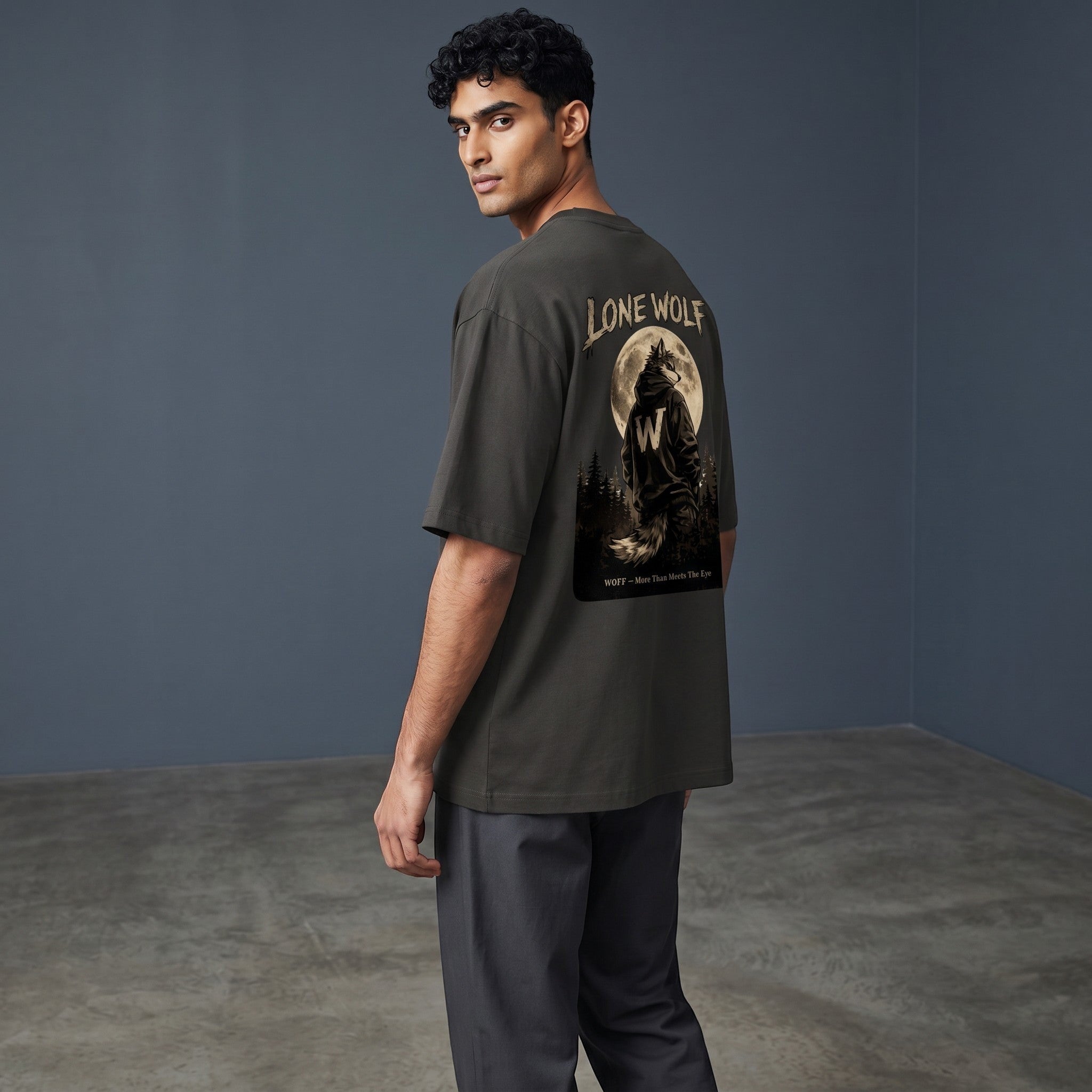 WOFF unisex oversized charcoal cotton t-shirt with Lone Wolf graphic print on the back, worn by a male model.
