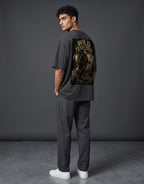 WOFF unisex oversized charcoal cotton t-shirt with Wild Territory graphic print on back, worn by a male model.