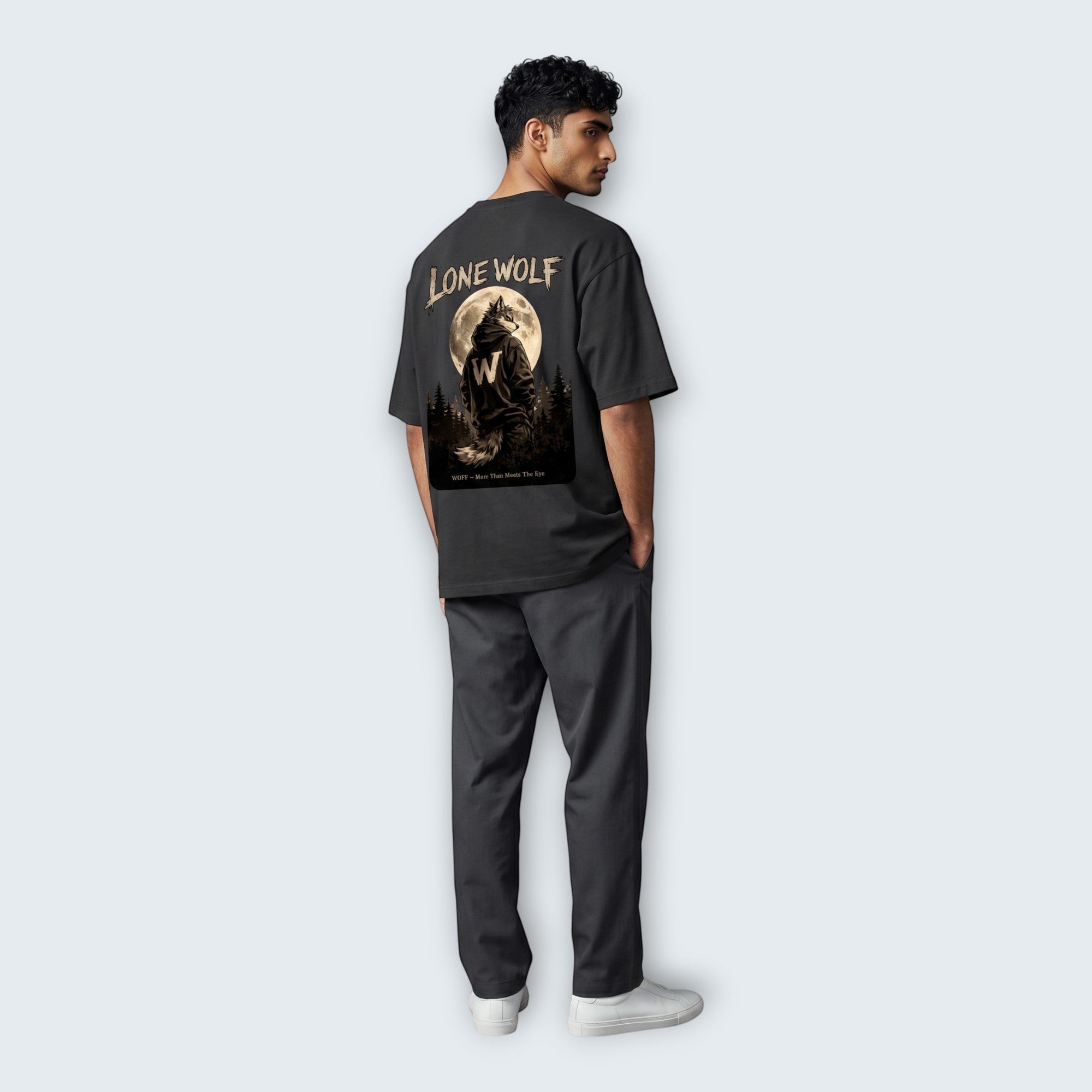 WOFF unisex oversized charcoal cotton t-shirt with Lone Wolf graphic print on back, worn by a man