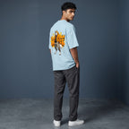 WOFF light blue oversized terry cotton t-shirt with a wolf character graphic on the back, worn by a male model.