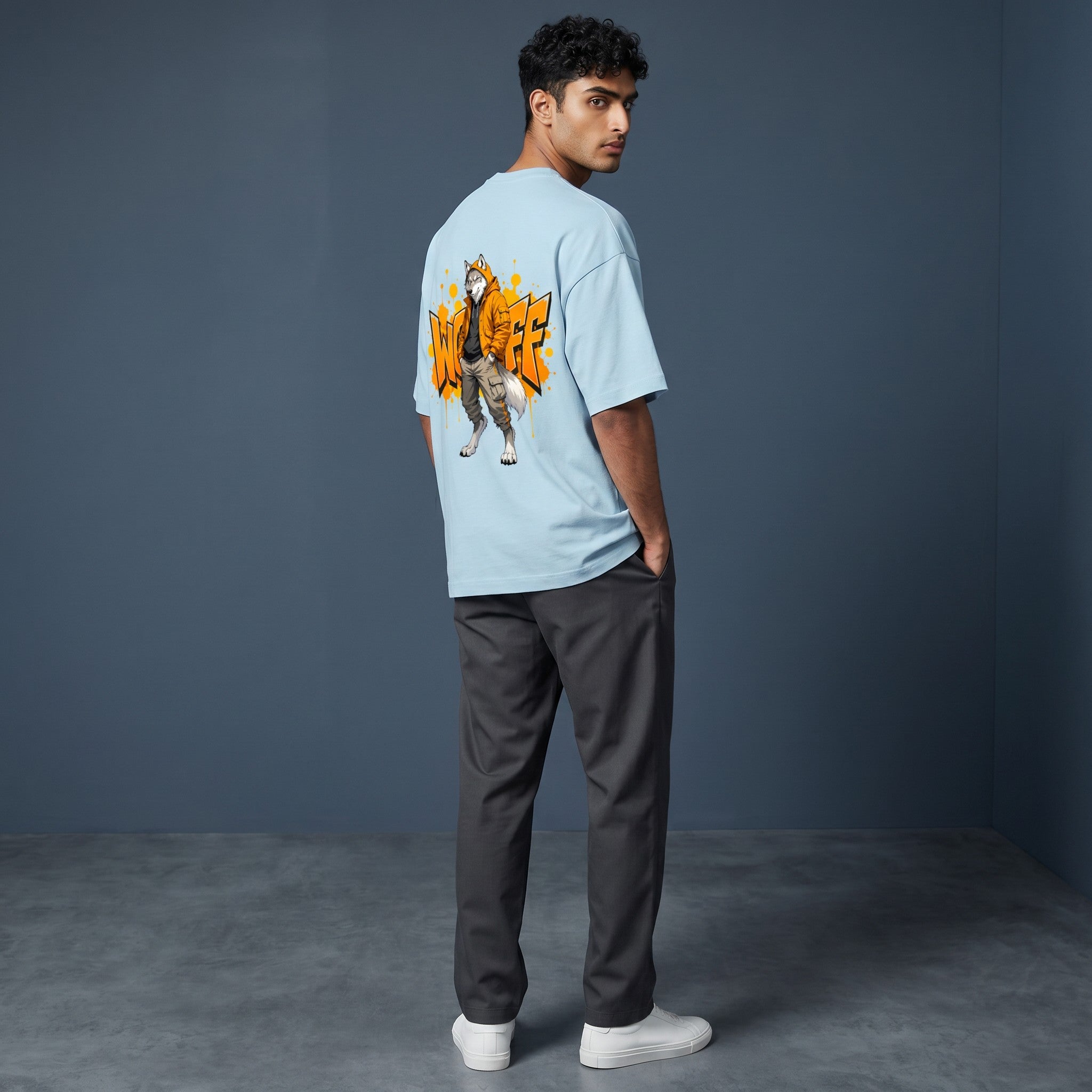 WOFF light blue oversized terry cotton t-shirt with a wolf character graphic on the back, worn by a male model.