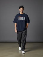 WOFF navy oversized unisex tee with drop shoulders and Lead Quietly graphic print worn by a male model