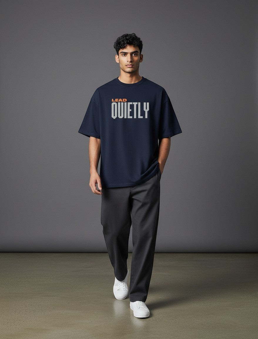 WOFF navy oversized unisex tee with drop shoulders and Lead Quietly graphic print worn by a male model