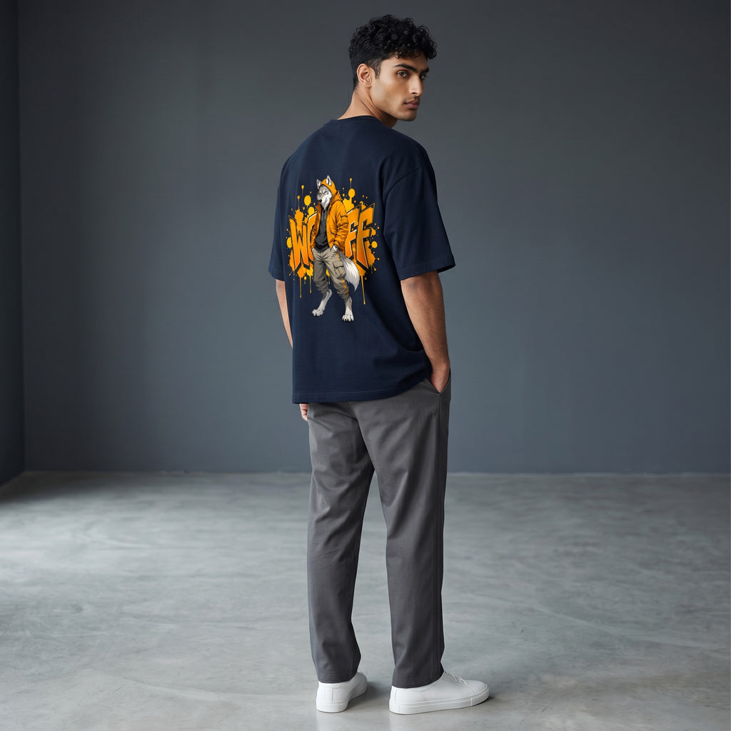 WOFF unisex oversized navy blue terry cotton t-shirt with a graphic wolf print on the back, worn by a male model.
