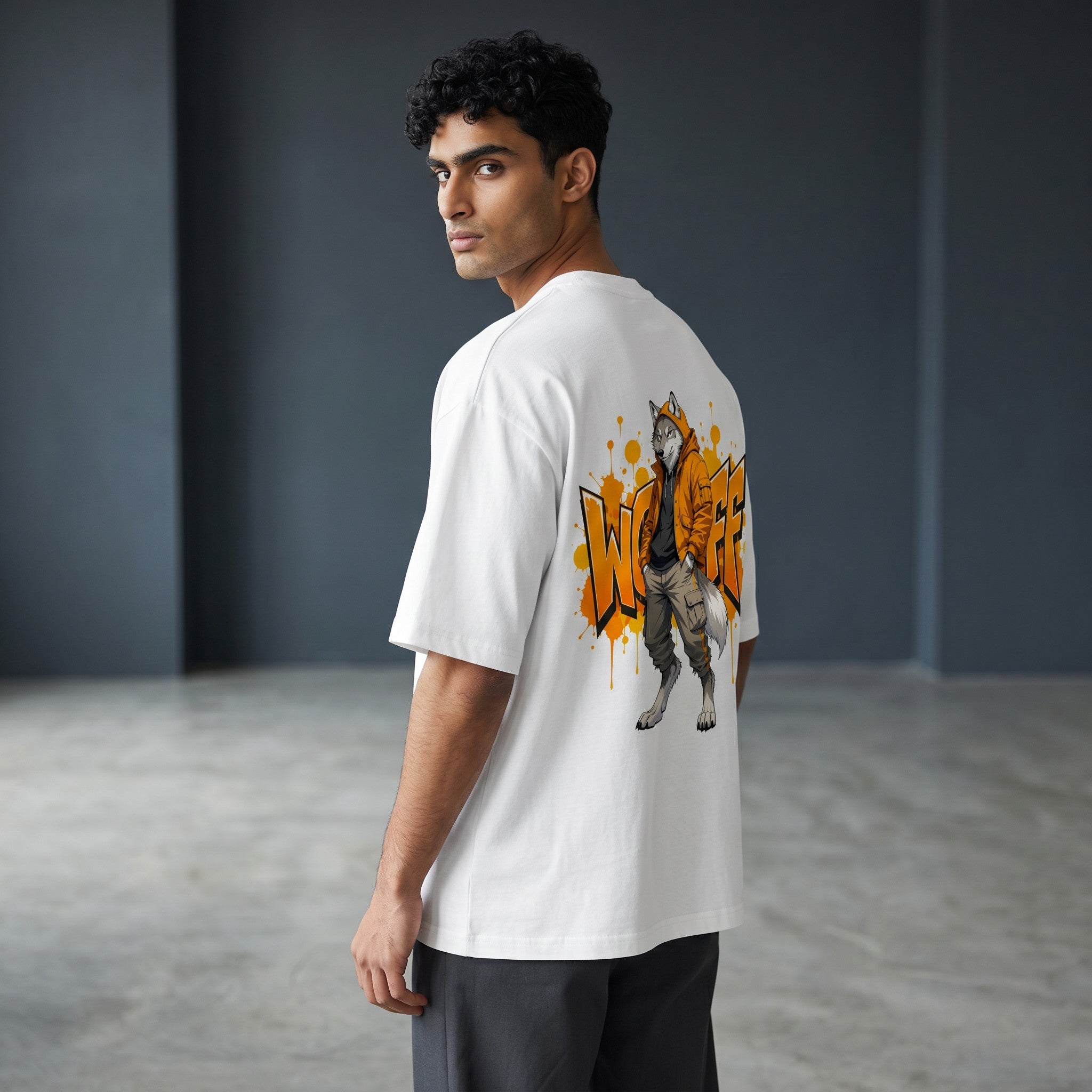 WOFF unisex oversized white terry cotton t-shirt with a wolf graphic print on the back, worn by a male model.