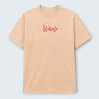 WOFF peach crew neck t-shirt with pink embroidered "Whelp" logo on chest. 100% cotton, regular unisex fit.