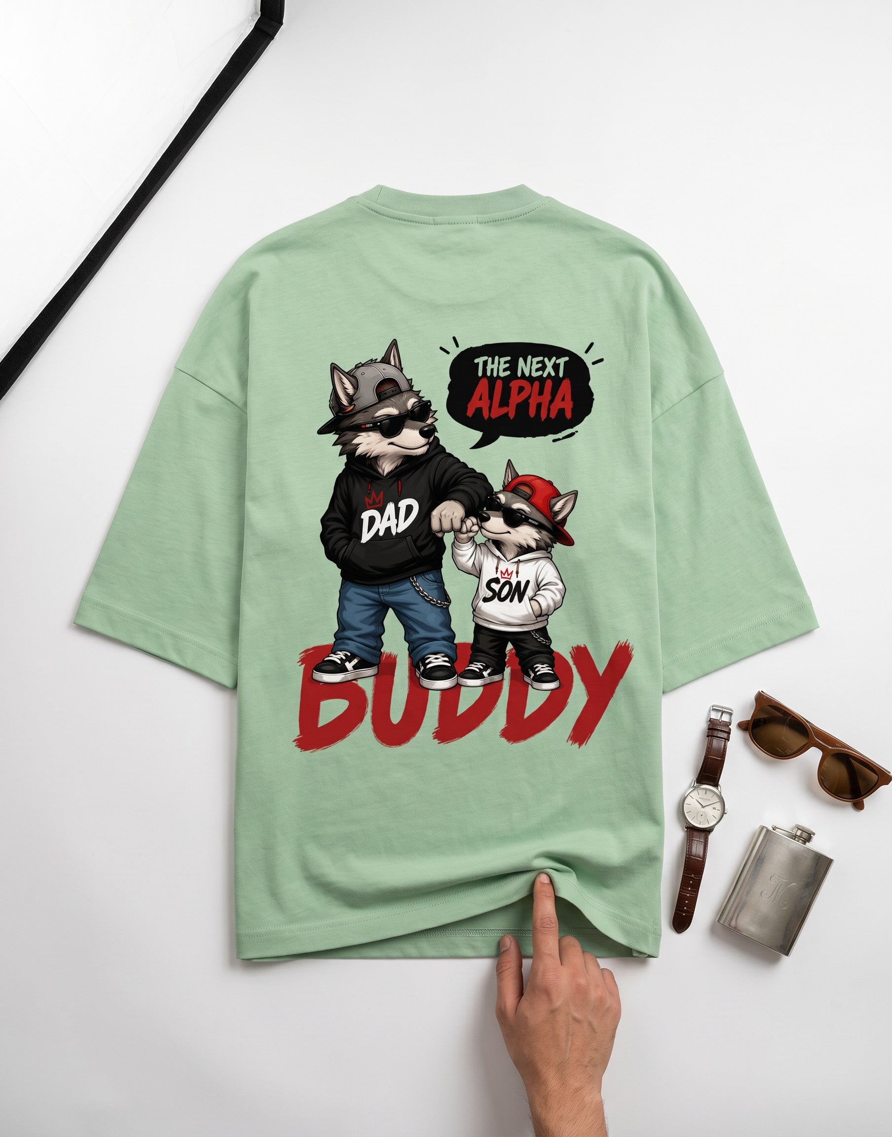 WOFF sage green oversized cotton t-shirt with a graphic print of a wolf dad and son duo on the back