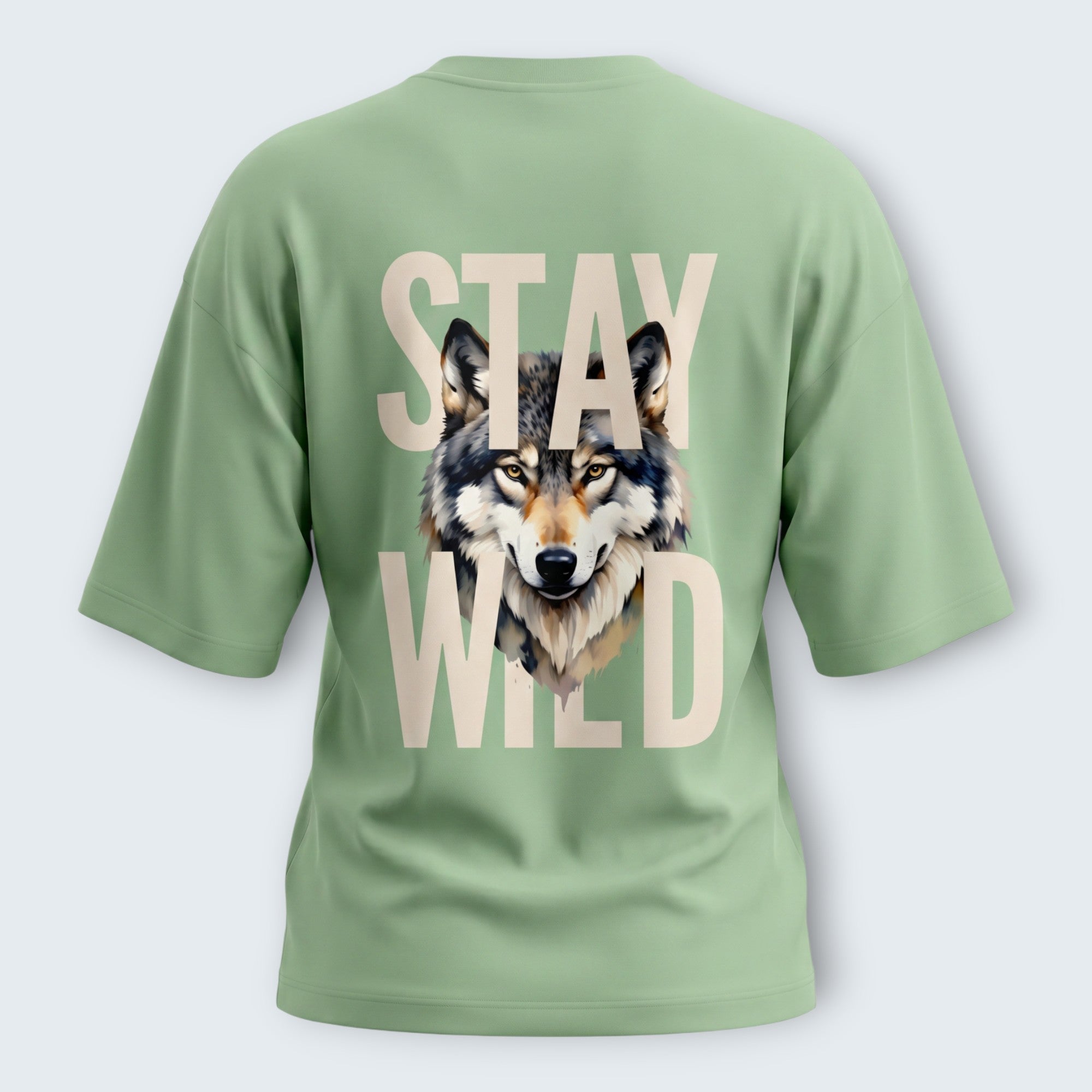 WOFF unisex oversized sage green terry cotton t-shirt with a wolf graphic and Stay Wild text on the back