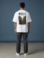 WOFF Wolf Street white oversized cotton t-shirt with forest graphic print on back worn by a man