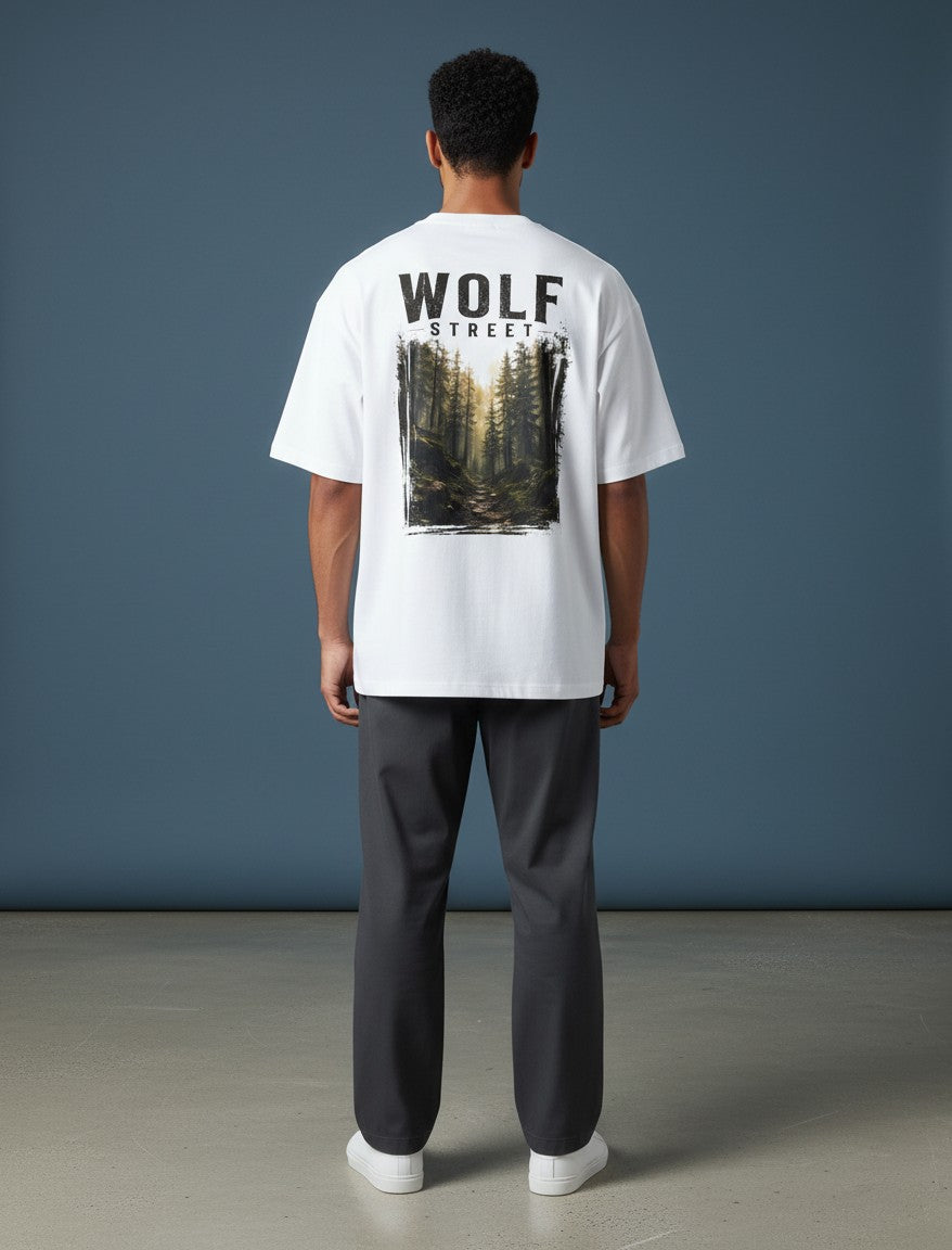 WOFF Wolf Street white oversized cotton t-shirt with forest graphic print on back worn by a man